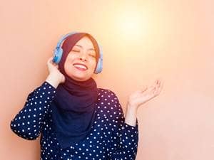 Muslim woman listening to music